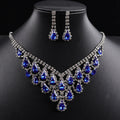 A luxurious and sophisticated diamond-encrusted geometric teardrop tassel necklace set exuding elegance and style