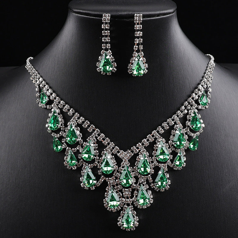 A luxurious and sophisticated diamond-encrusted geometric teardrop tassel necklace set exuding elegance and style